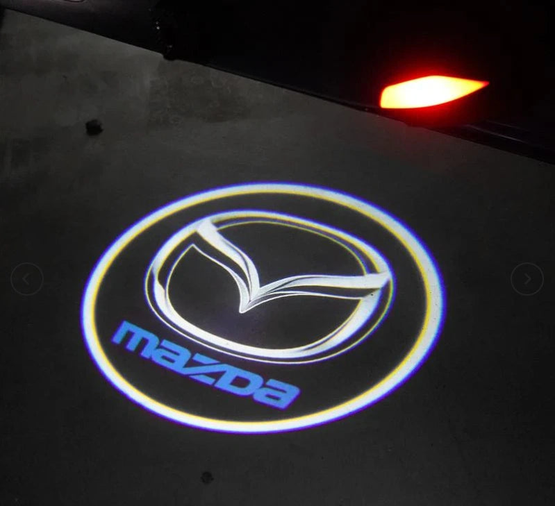 LUMIGLOW™ LUCES DE BIENVENIDA CON EL LOGO + ENVIÓ GRATIS (2 PIEZAS)